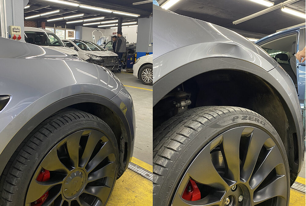 Gri Tesla Model Y çamurluk bölgesindeki göçüğün boyasız göçük düzeltme (PDR) ile onarılması